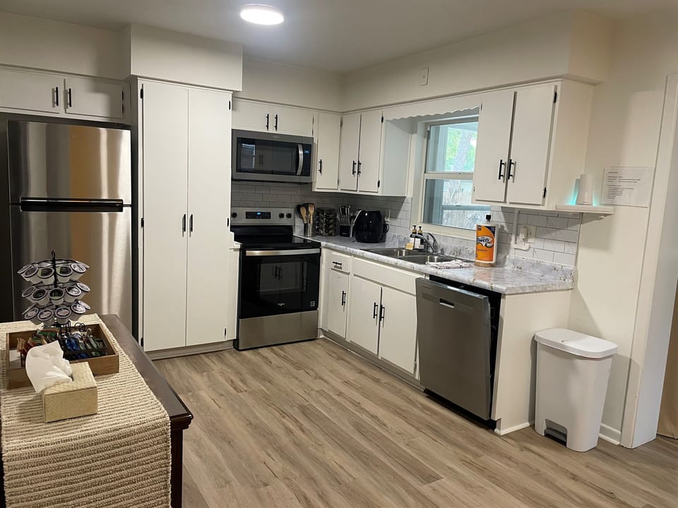 Fully stocked kitchen adjoins the dining room to the right