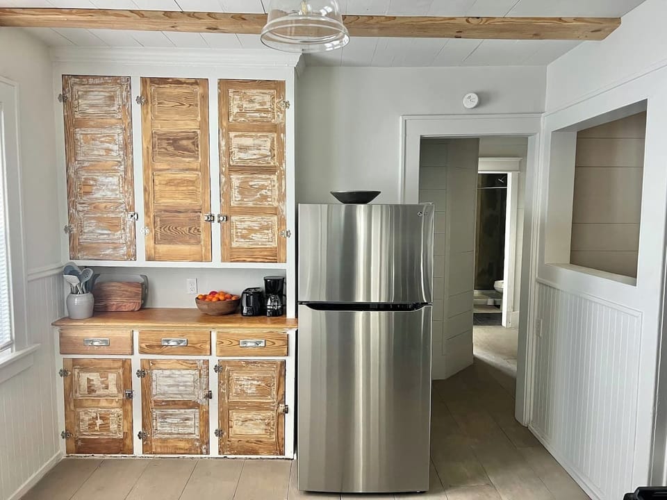 Kitchen with pots and pans ,utensils, basic kitchen spices, sugar, etc