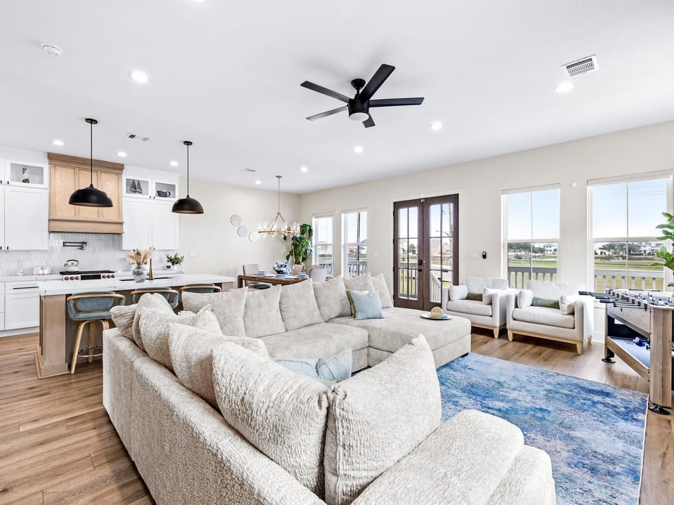 Living room area with large views of horse ground and water