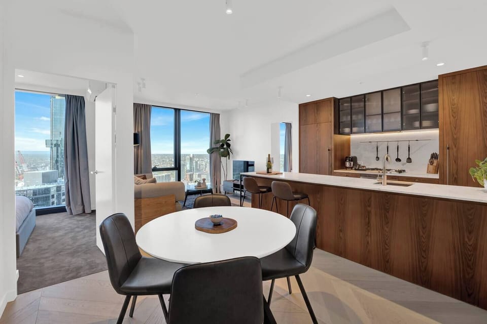 Open-plan dining area with kitchen and city views