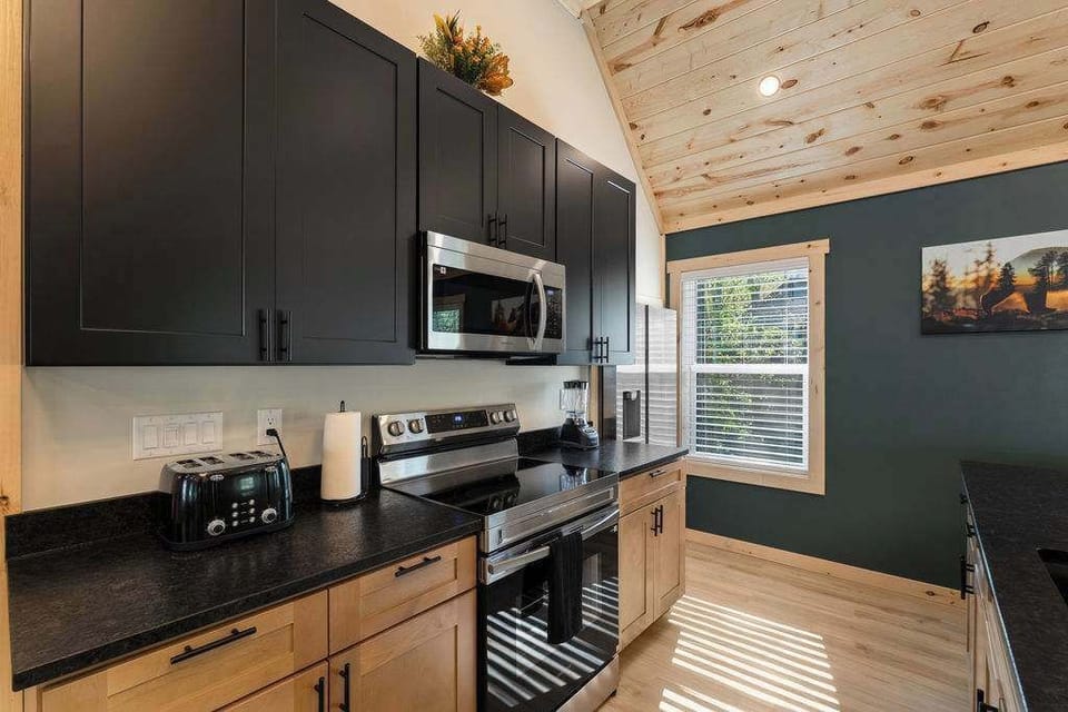 Custom Cabinets with Stainless Steel Appliances and Granite Countertops. 
