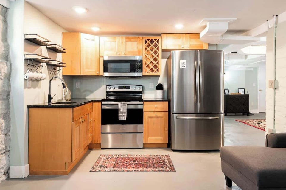 Kitchen: Fully equipped kitchen featuring contemporary appliances, ample counter space, and a bright, airy feel. Ideal for preparing meals or enjoying a relaxed dining experience at home.