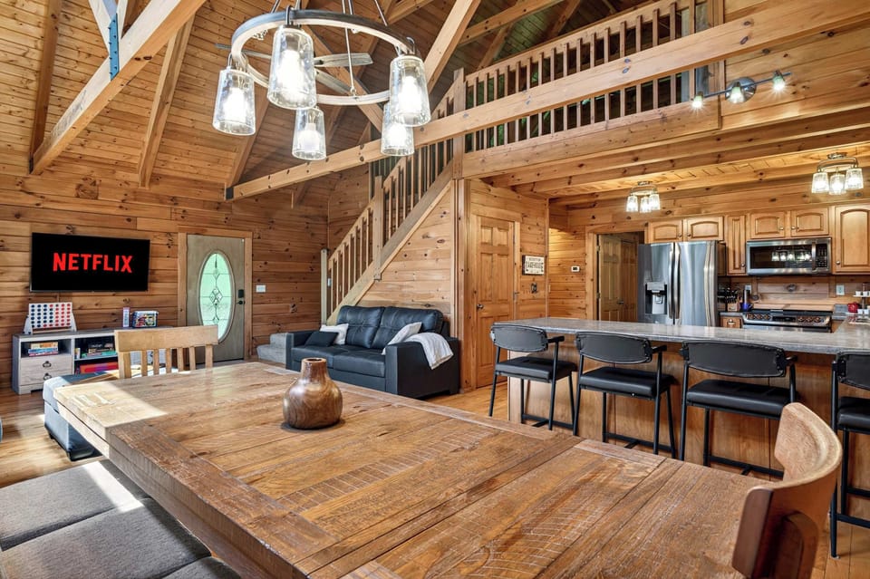 Living Room: Gather around the fireplace after a day on Rough River Lake — this is where the group stories get told.