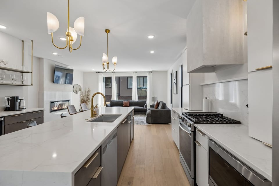 Kitchen: Skip the reservations — the gourmet kitchen is fully equipped with premium appliances, a spacious island, and every coffee option imaginable to start your morning right.