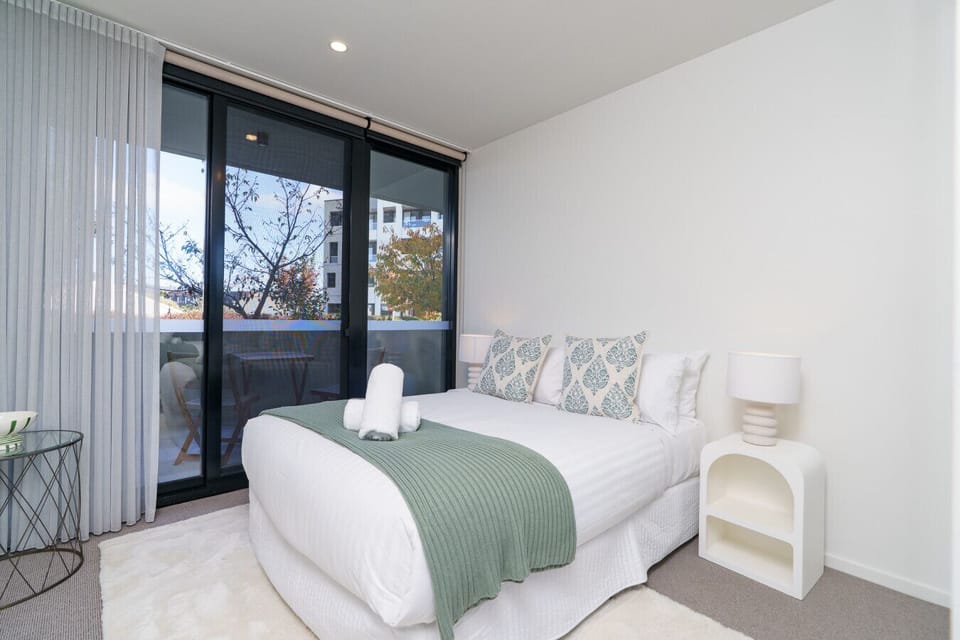 Comfortable bedding and calming tones create the perfect retreat.