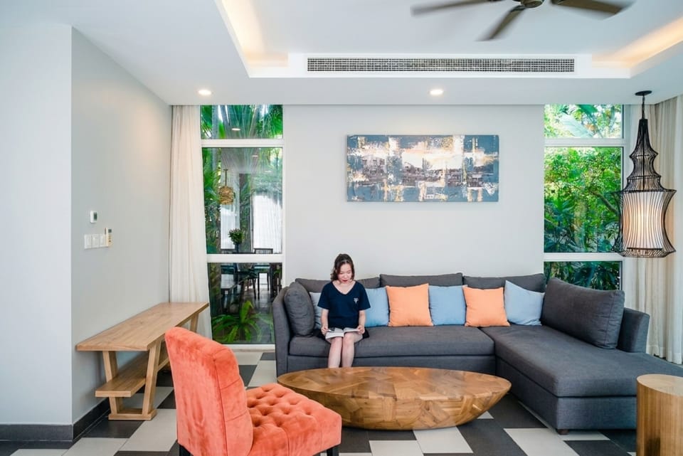 Deluxe Villa, 4 Bedrooms, Resort View, Courtyard Area | Living area | 50-inch LCD TV with cable channels