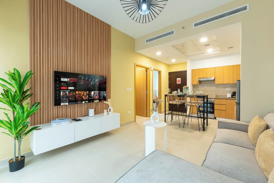 Deluxe Apartment | Living area | 65-inch Smart TV with cable channels, Netflix, streaming services