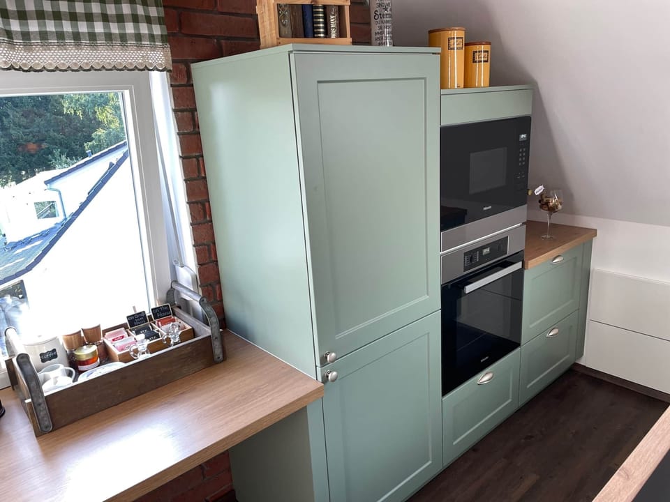 Cook, reheat, or chill with ease—modern fridge, oven, and microwave at your service.