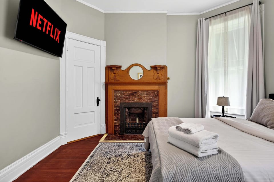Bedroom 1: Relax in this cozy bedroom featuring soft linens, warm lighting, and a calming atmosphere. Perfect for restful nights and peaceful mornings after a day of exploring.