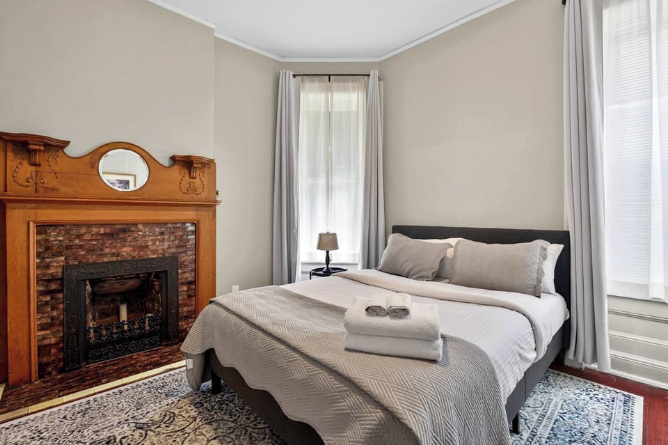 Bedroom 1: Relax in this cozy bedroom featuring soft linens, warm lighting, and a calming atmosphere. Perfect for restful nights and peaceful mornings after a day of exploring.