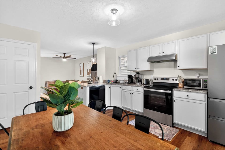 Dining Area: Gather around in this inviting dining area, perfect for enjoying meals, morning coffee, or meaningful conversations with family and friends during your stay.