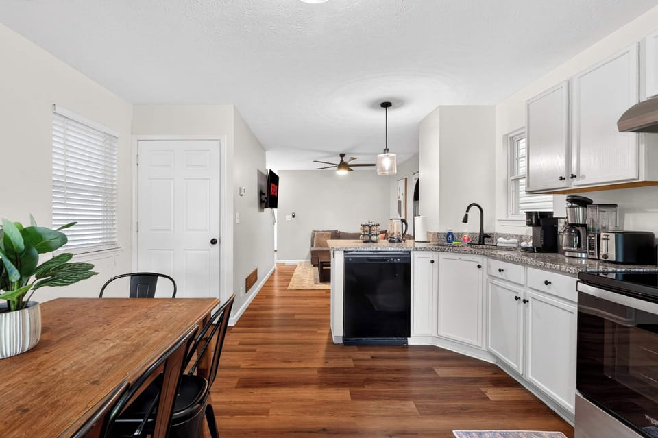 Kitchen: Bright and welcoming, this kitchen features updated appliances, functional space, and all the essentials for cooking, dining, and gathering together.