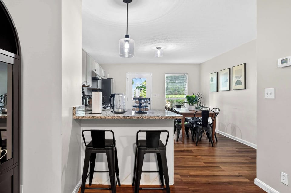 Dining Area: Gather around in this inviting dining area, perfect for enjoying meals, morning coffee, or meaningful conversations with family and friends during your stay.