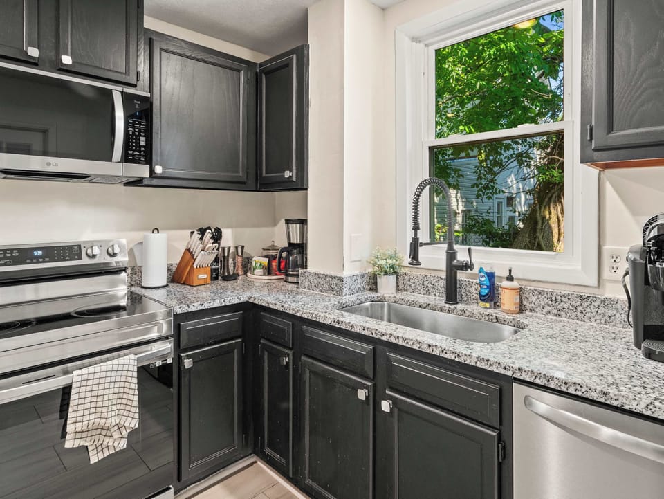 Kitchen: Whether you're preparing a quick snack or a full dinner, this spacious kitchen offers everything you need in a bright and welcoming space.