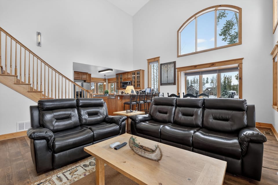 Sink into plush leather sofas in your soaring living room at 21 GCR 4435 , where mountain views frame your relaxation.