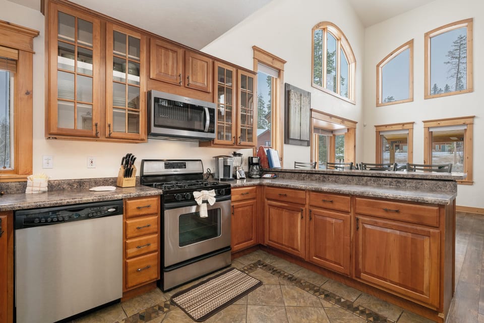 Your gourmet kitchen at 21 GCR 4435 features granite countertops, warm wood cabinets, and full stainless appliances to create memorable meals.