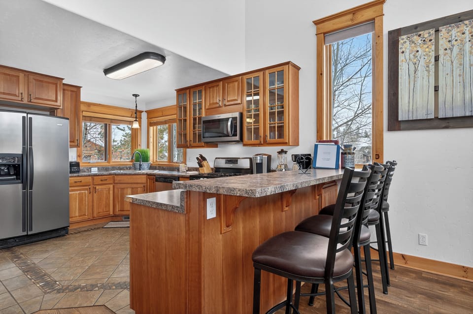 Cook up memorable meals at 21 GCR 4435 in your spacious kitchen with granite counters, modern appliances, and a breakfast bar perfect for morning coffee.