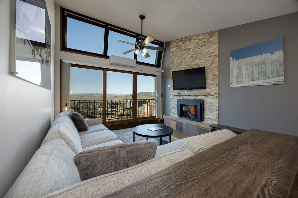 Unwind in your cozy retreat where mountain views meet modern comfort. Your private fireplace adds warmth to relaxing evenings.