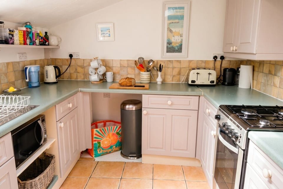 Every cooking essential is here, including a four-slice toaster and gas range.