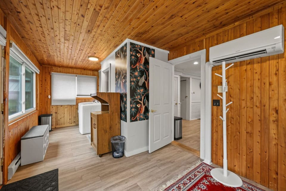 Bright and functional laundry space with easy access to essentials and extra storage.