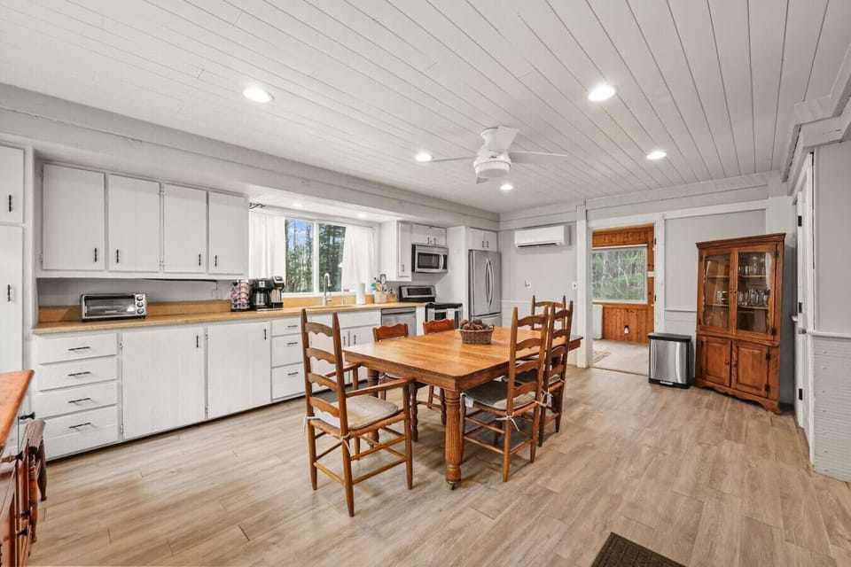 Enjoy meals together at this spacious dining table with seating for the whole group.