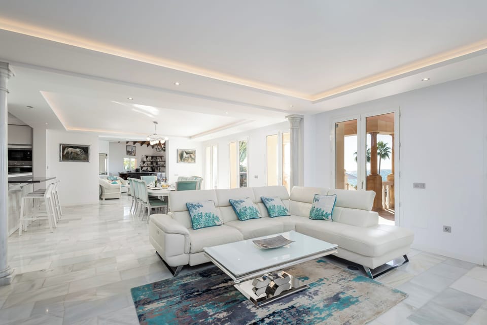 Expansive open-plan living area featuring premium furnishings and sea breezes.