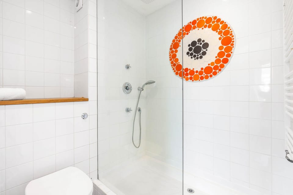 Inviting bathroom with gleaming basin, soft lighting and modern toilet suite