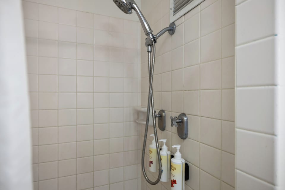Step into your private shower with premium toiletries and modern fixtures for a refreshing start to your day.