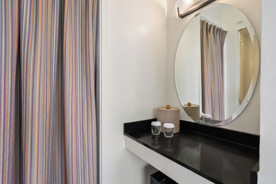 Step into your sleek bathroom vanity with modern styling and thoughtful amenities for your comfort.