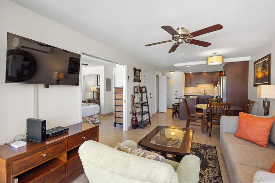 Your spacious open-plan living area seamlessly flows from cozy seating to dining and modern kitchen, perfect for unwinding after island adventures.