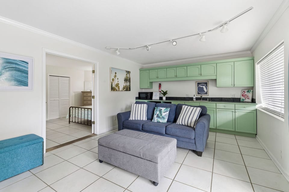 Kick off your flip-flops, sink into the couch, and relive the day’s beach adventures together in separate main level suite. 