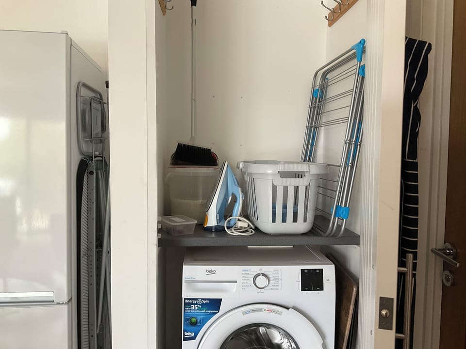 Laundry cupboard, clothes airer, and ironing board, apron
