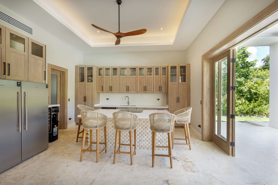 Modern kitchen with island seating and direct access to outdoor areas