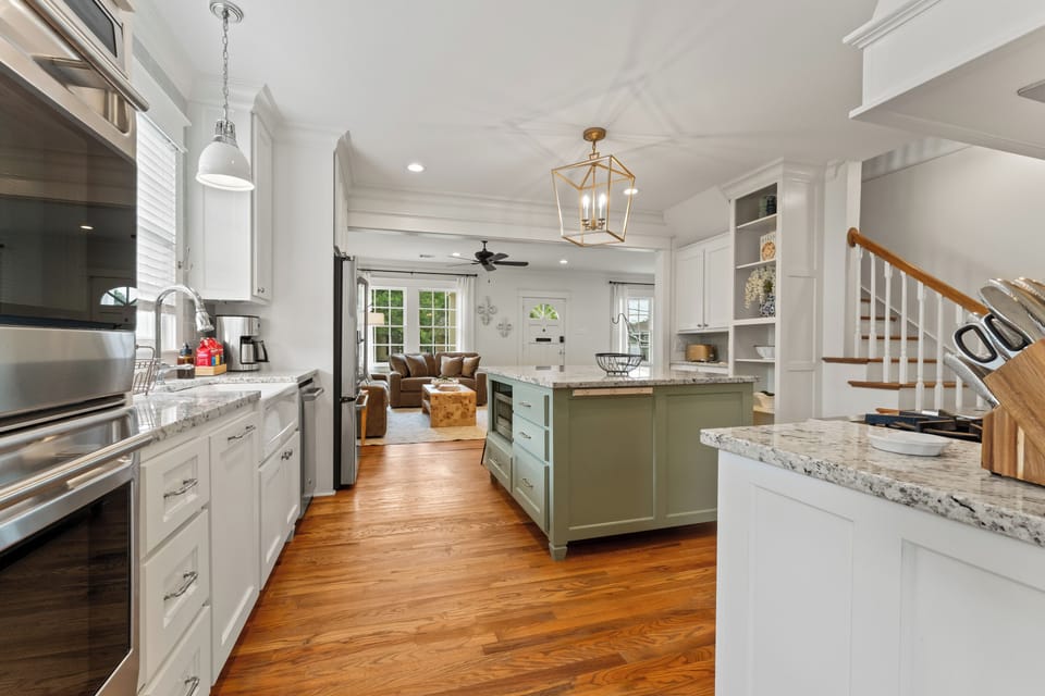 The spacious island with built-in microwave offers added convenience and plenty of room for prep, dining, or gathering.