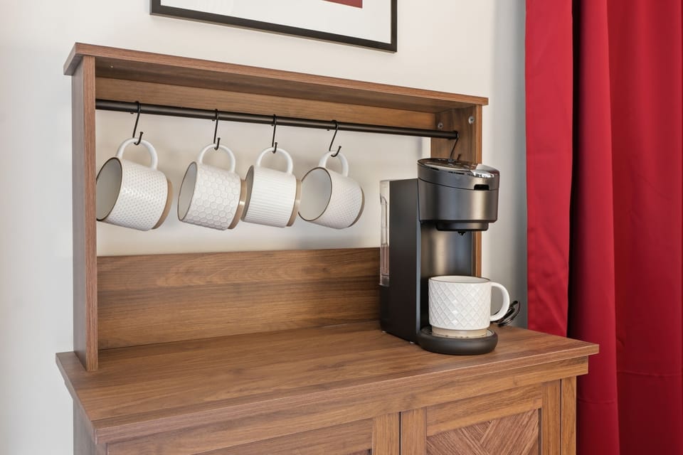 No need to head downstairs for your first cup — this bedroom has its own Keurig and mug rack ready to go. Morning sorted before you even put your shoes on.