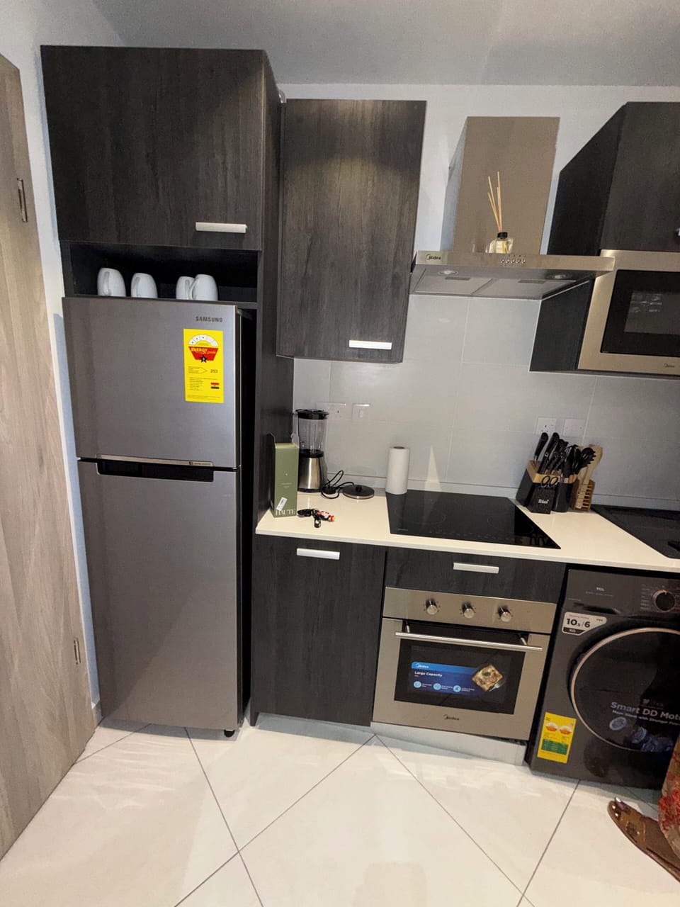 Fridge, microwave, oven, cookware/dishes/utensils