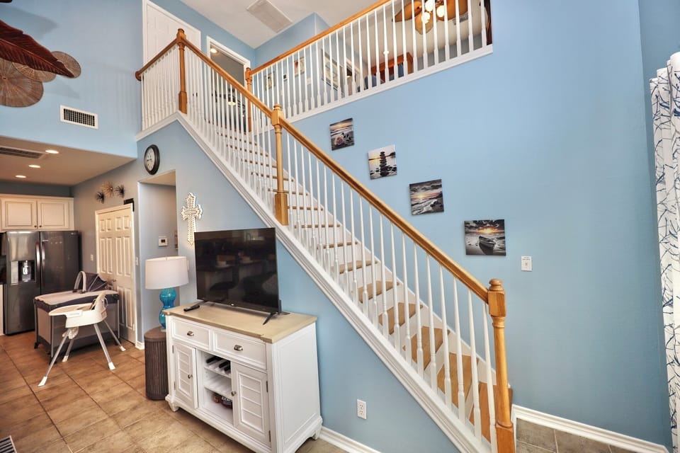 stairways leading up to the second living room and master suite