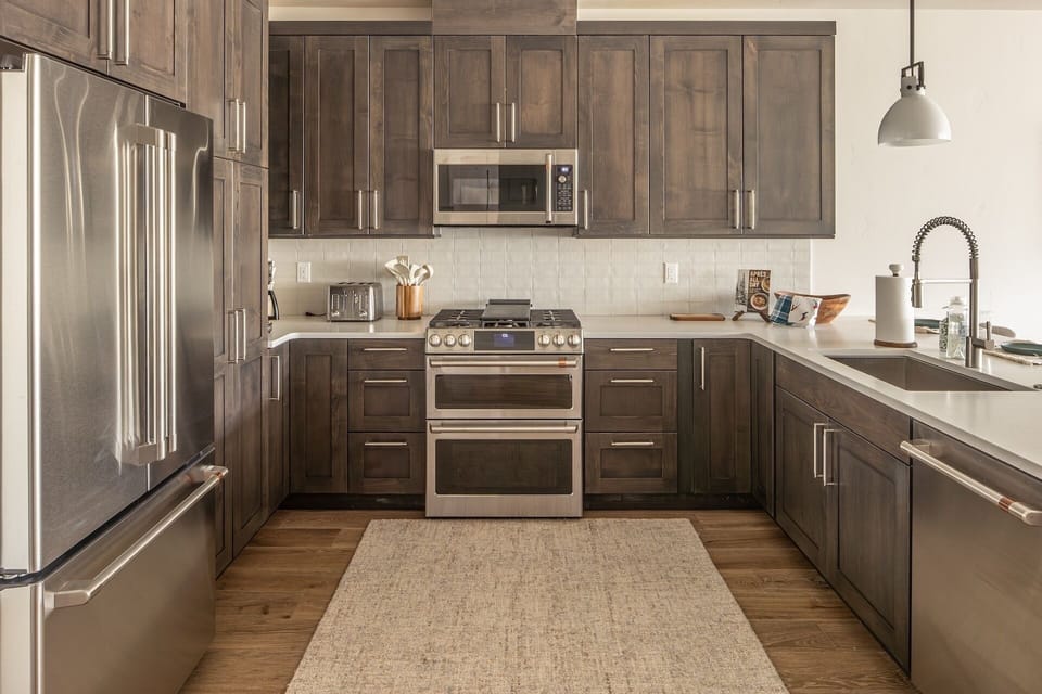 Cook your favorite meals in this stylish modern kitchen with premium appliances, ample storage, and beautiful countertops.