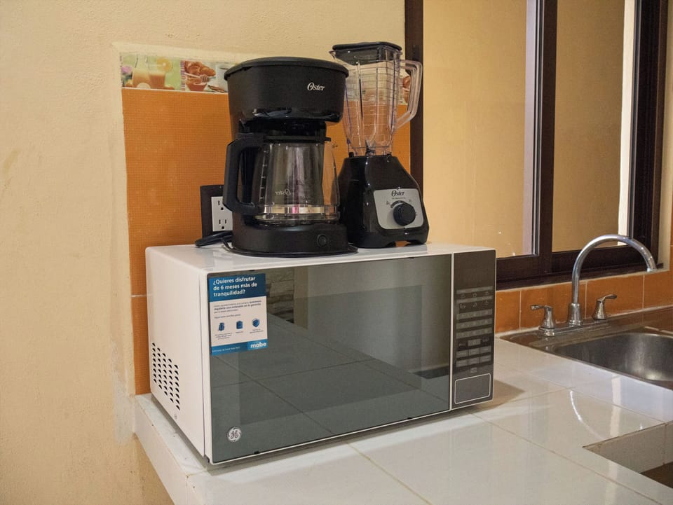 Deluxe Studio | Private kitchen | Coffee/tea maker, full-size fridge, microwave, blender