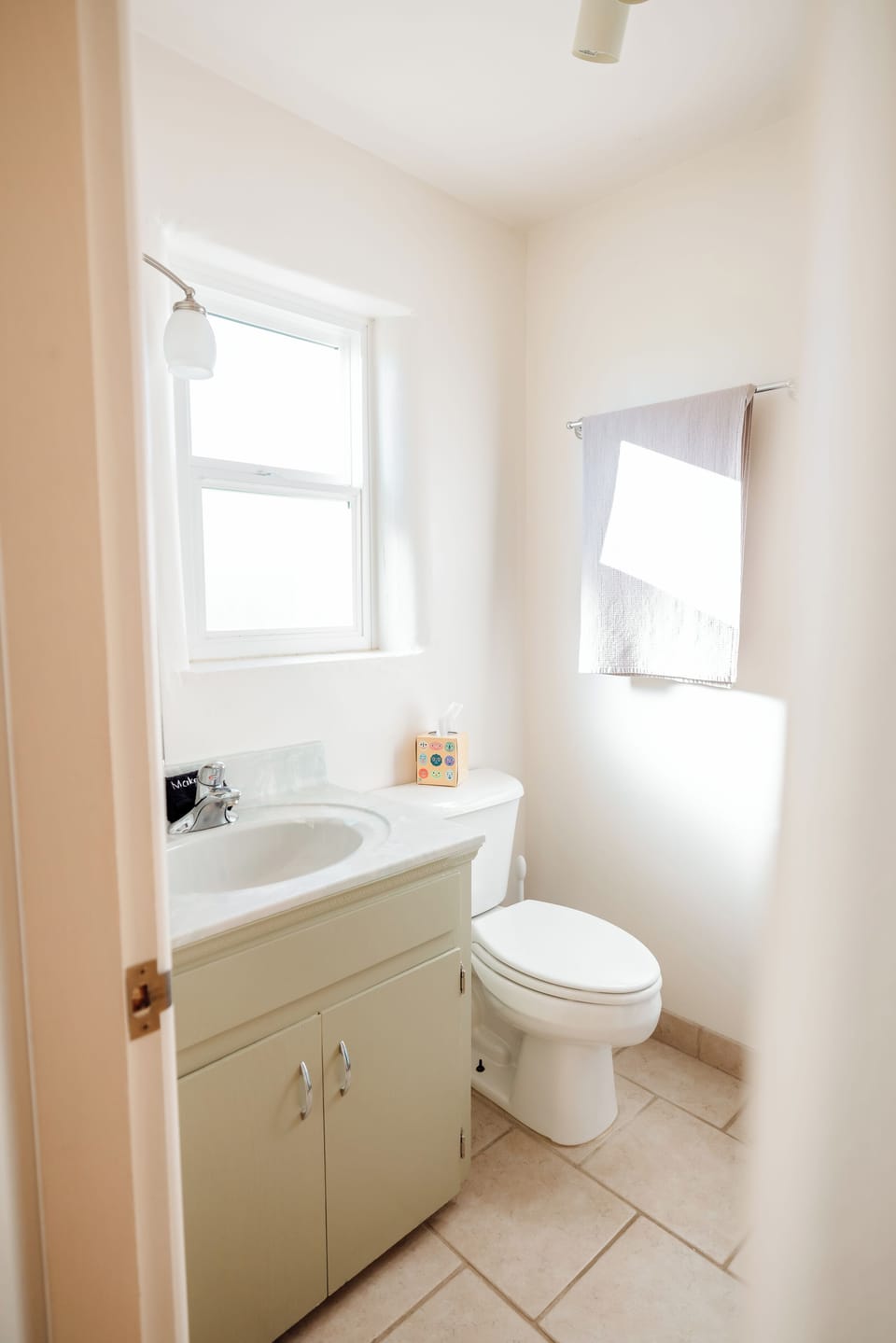 Second bathroom  single sink and shower stall with Public Goods products. 