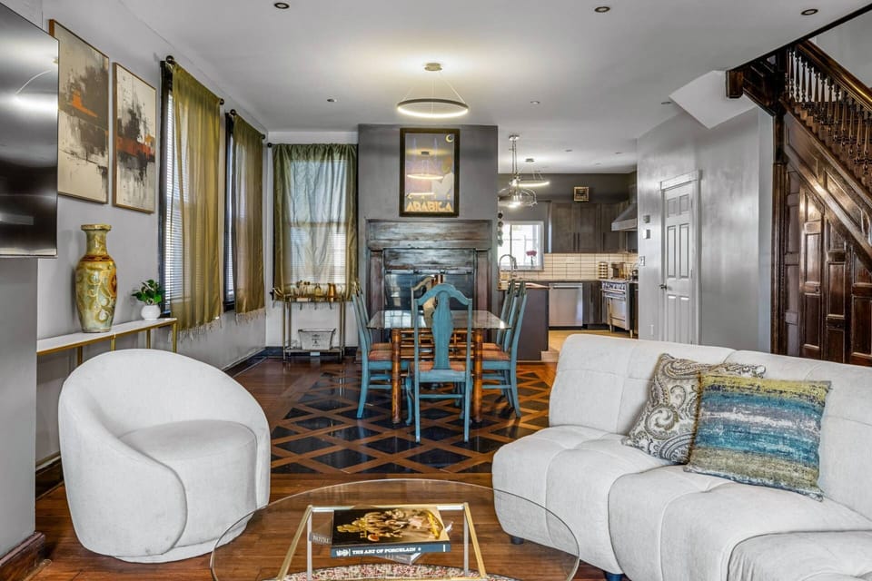 From the swivel chair through the dining room and fireplace all the way to the kitchen — this floor was made for gathering.