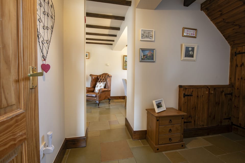 Ground floor: Hallway leading through into the sitting and dining area