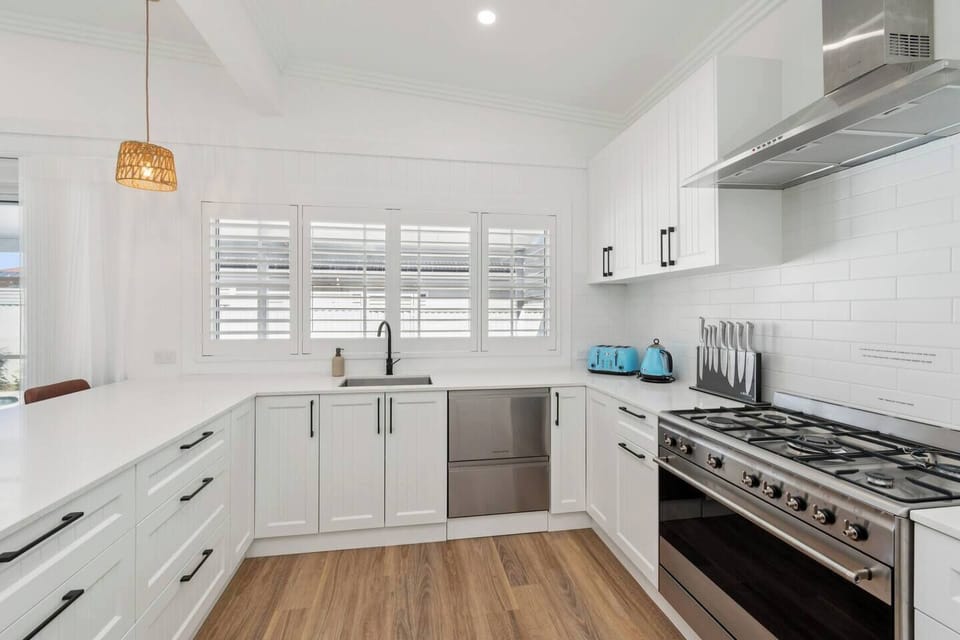 Cook with ease in the bright kitchen, where generous bench space and quality appliances support relaxed meal prep.
