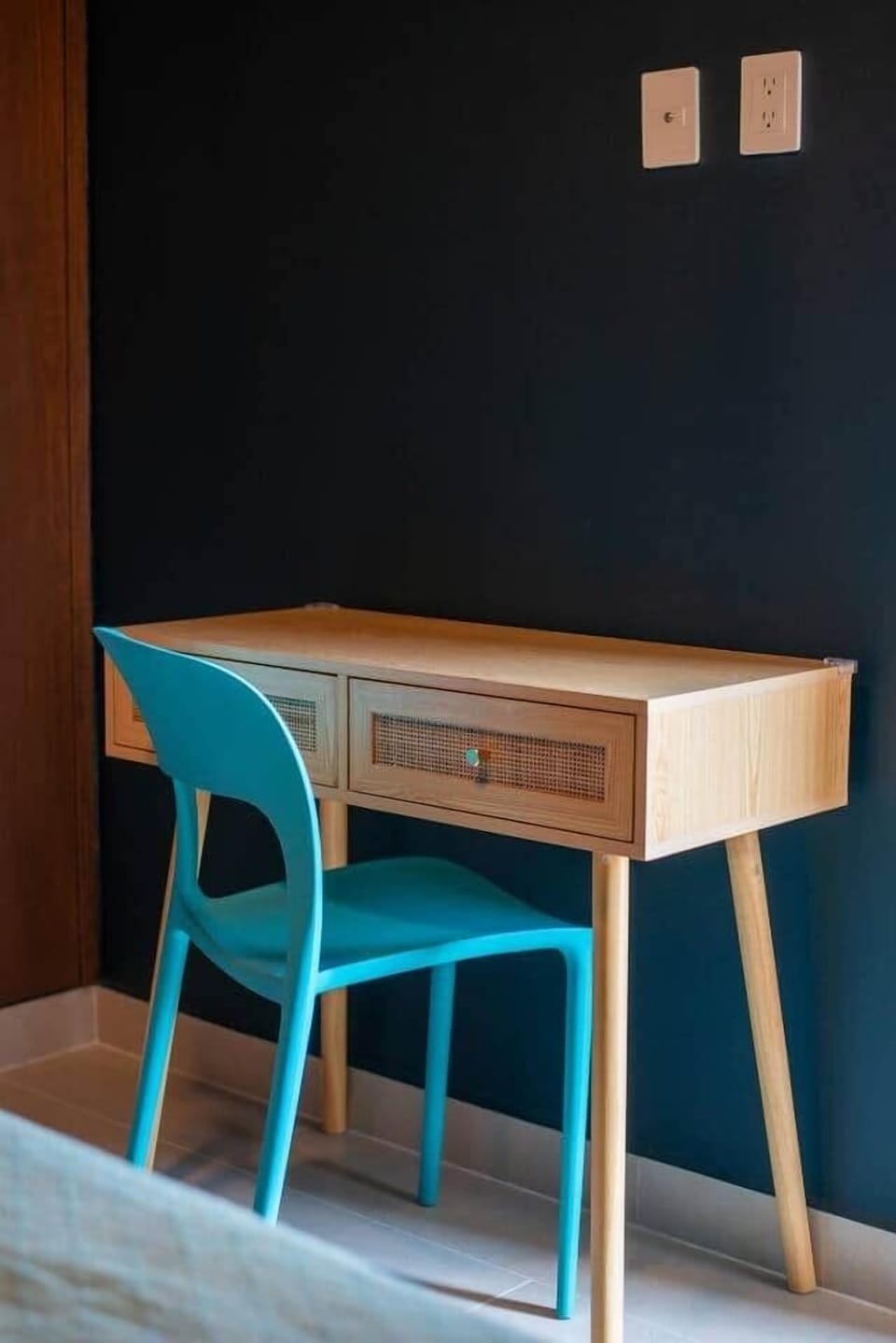 Dedicated workspace in one of the bedrooms, featuring a desk and chair—perfect for remote work, emails, or planning your day. Conveniently located near outlets for easy device charging.