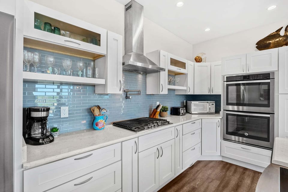 Beautiful fully equipped kitchen with coastal blue accents