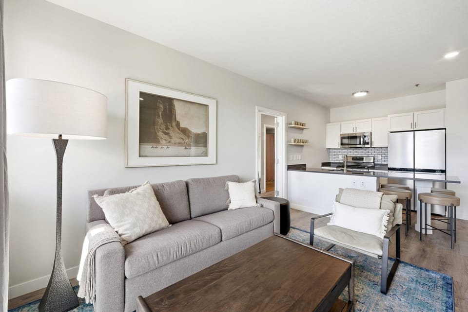 Open living and dining area with comfortable seating and seamless flow into the kitchen space