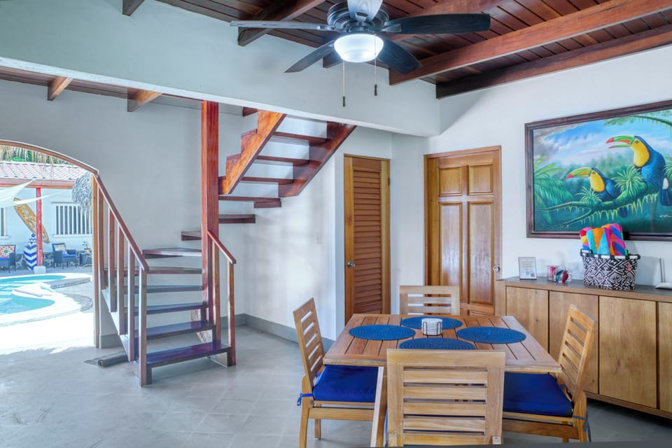 Bright tropical living space with pool view and a relaxing atmosphere.