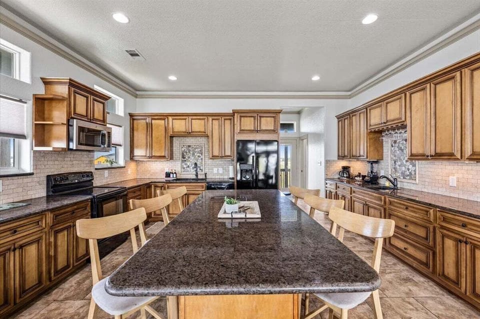 Kitchen with large counters & island – fully equipped Crystal Beach vacation home kitchen