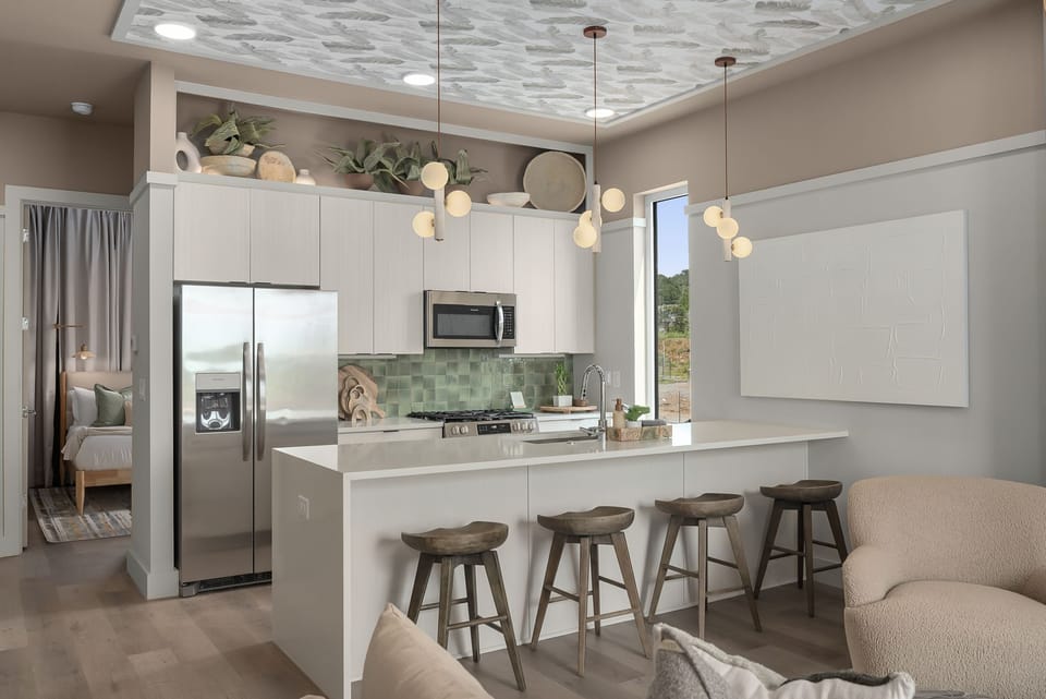 The second-floor open concept  kitchen provides a large peninsula for an abundance of counter space.