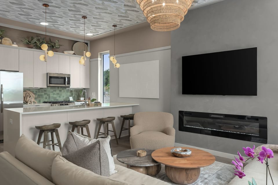 The second floor open concept living area offers a large smart TV and electric fire place.
